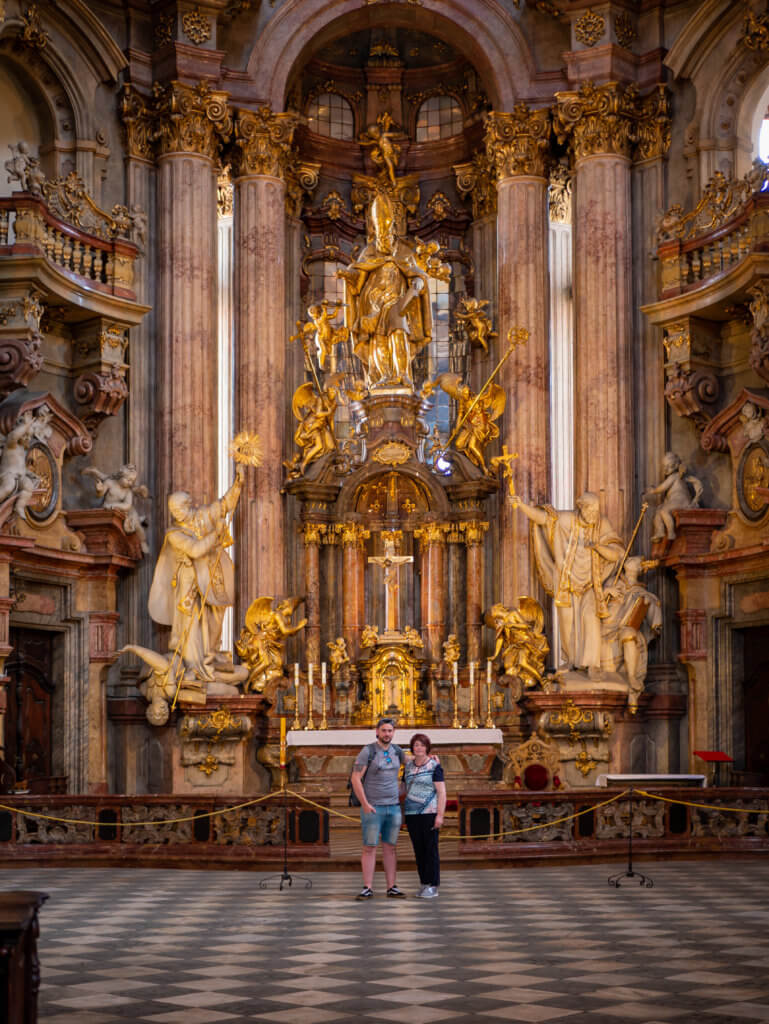 Woman with her son in St Nicholas Church Prague