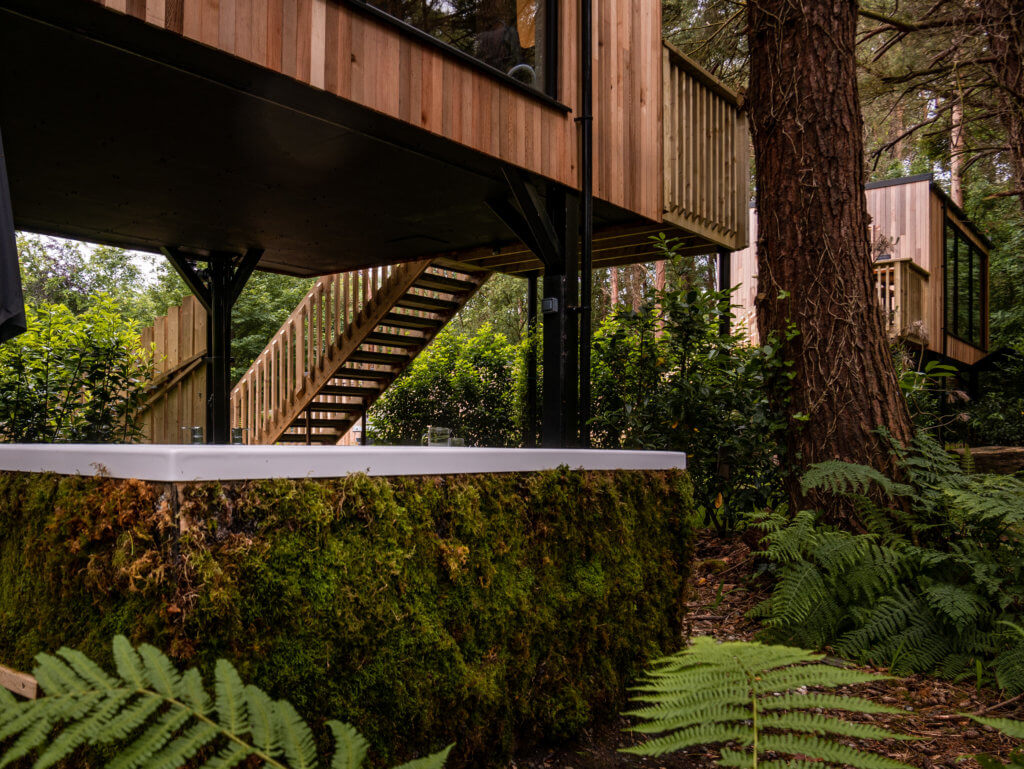 Outdoor hot tub under treehouse accommodation in Northern Ireland