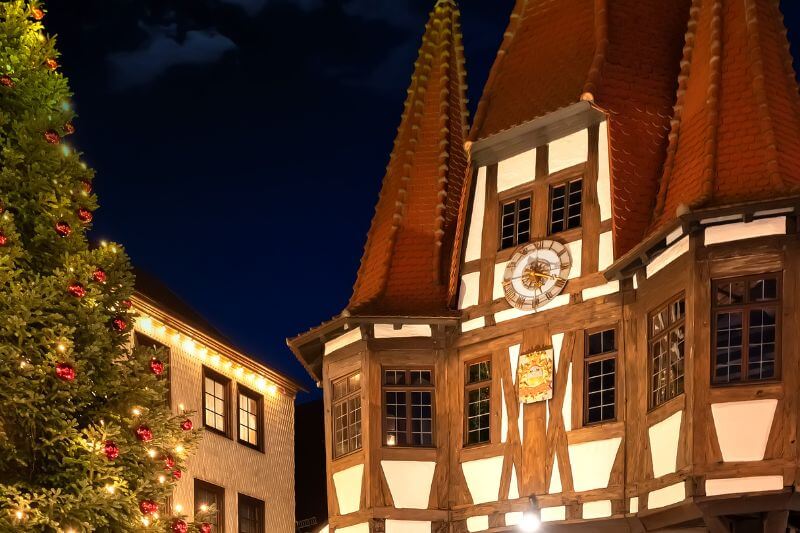 Michelstadt’s iconic town hall (Rathaus) illuminated with festive lights during the Christmas season.
