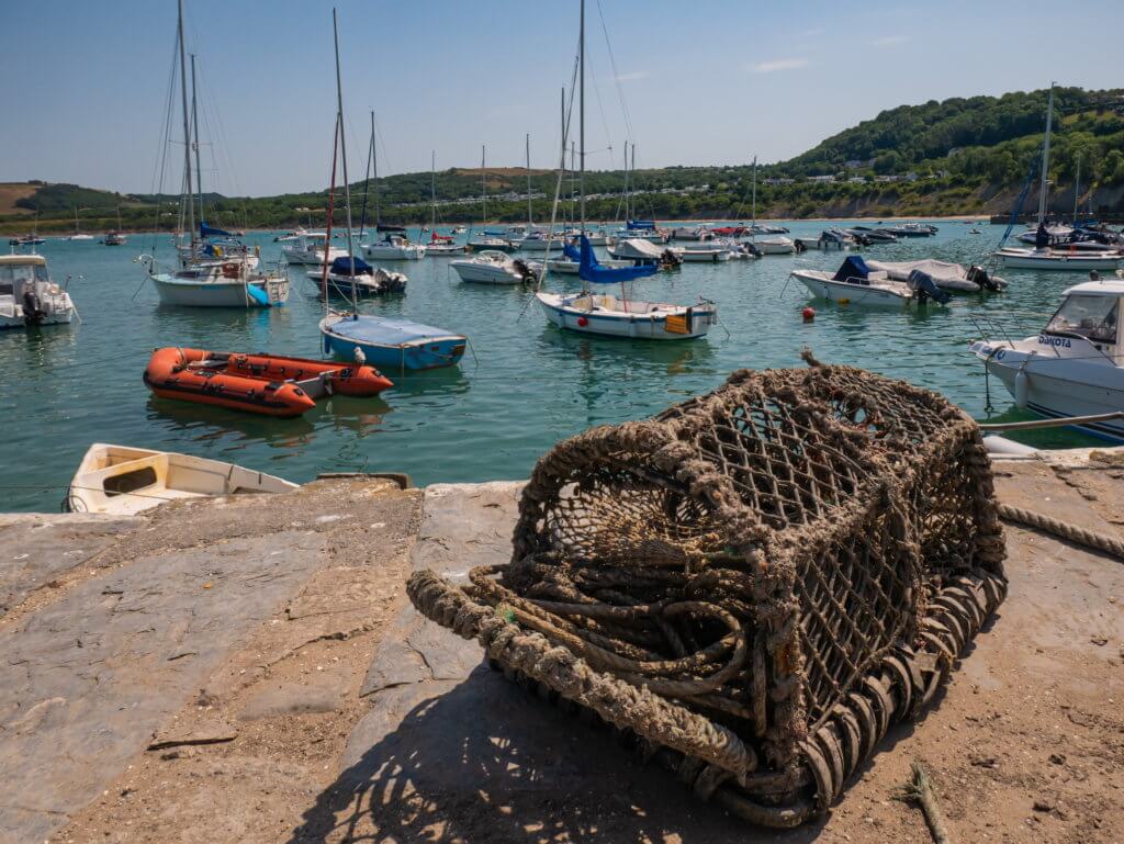 Lobster pot on the quay at New Quay Beach in Cardigan Bay Wales
