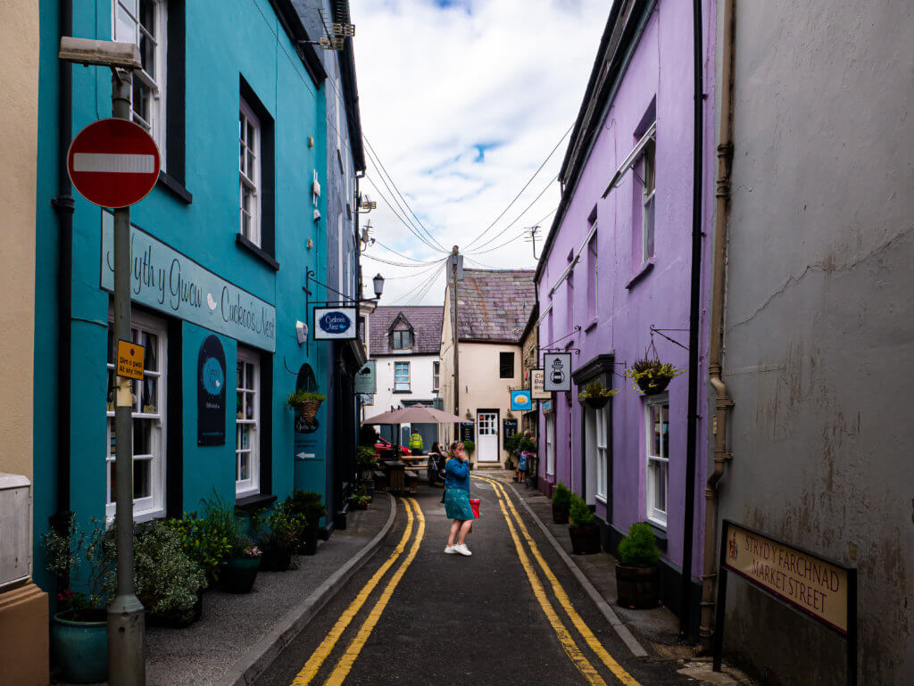 Woman shopping on market street in Llandeilo in Carmarthenshire West Wales