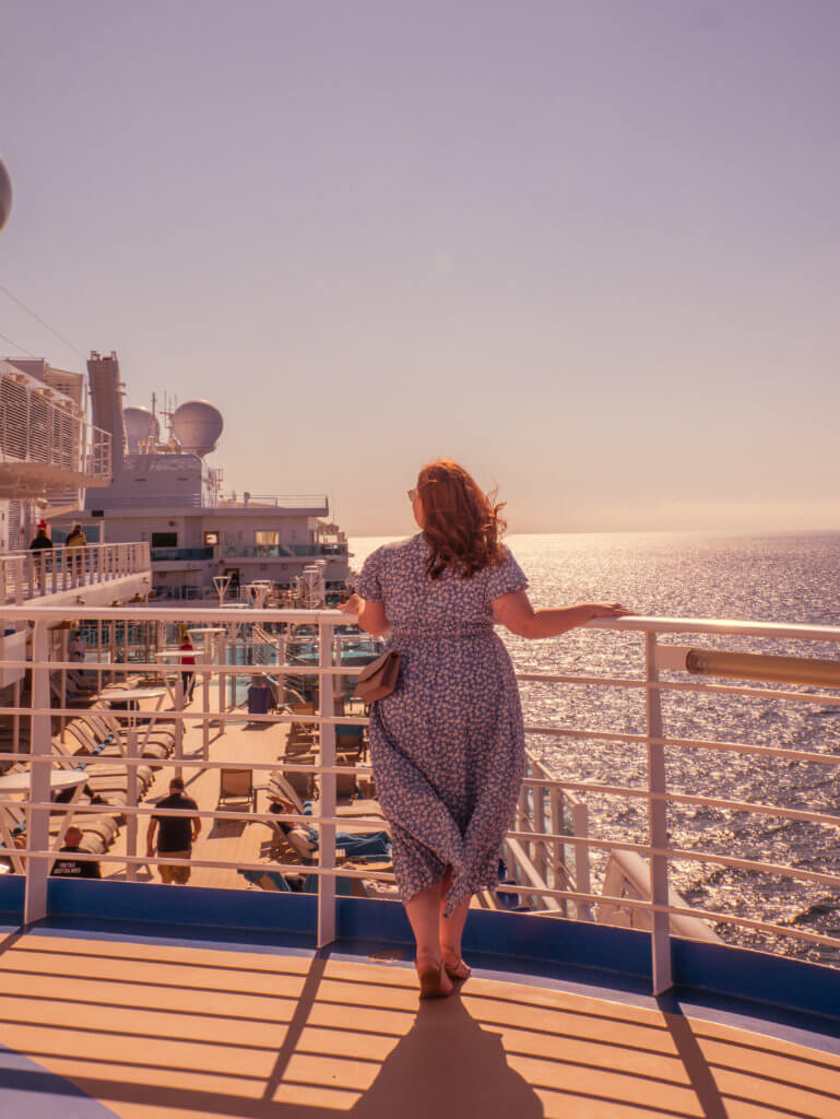 Woman standing on the deck of Sky Princess Cruise Ship