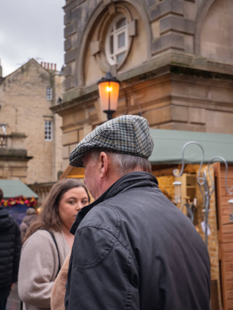 People walking around the markets during Christmas in Bath