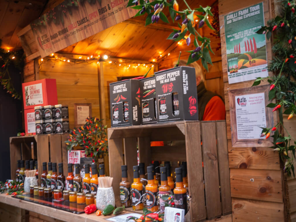 Wooden stall selling hot sauce at Bath Christmas market