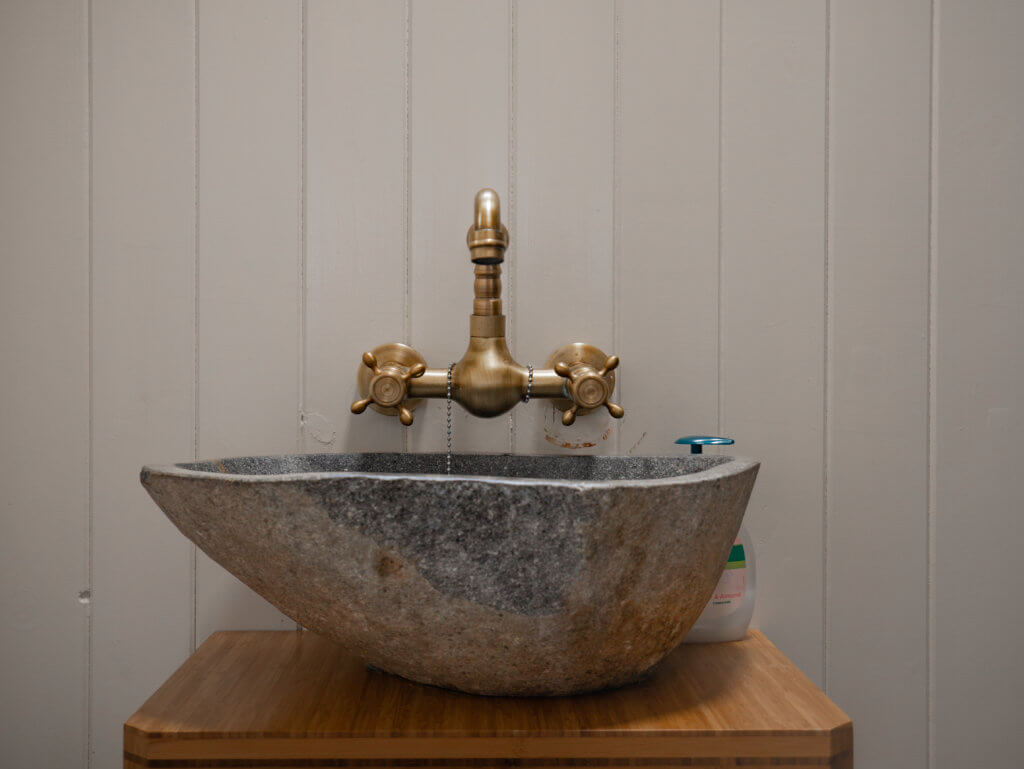 Stone sink in a Shepherds Hut at Beds of Silk glamping in Ireland