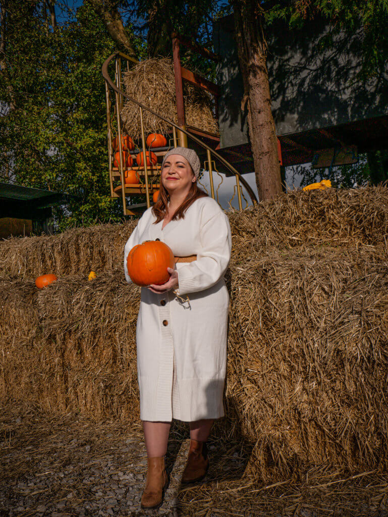 Woman holding a pumpkin at Killarney Pumpkin Farm Ireland