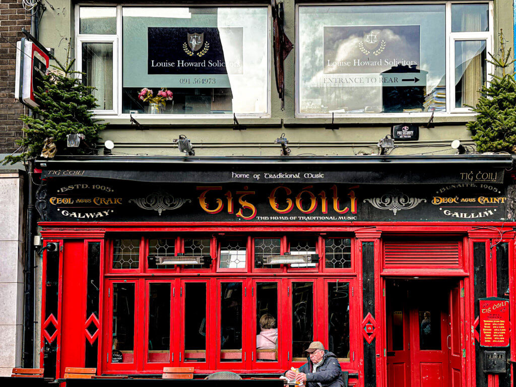 Red exterior of Tig Coili one of Galway's best pubs