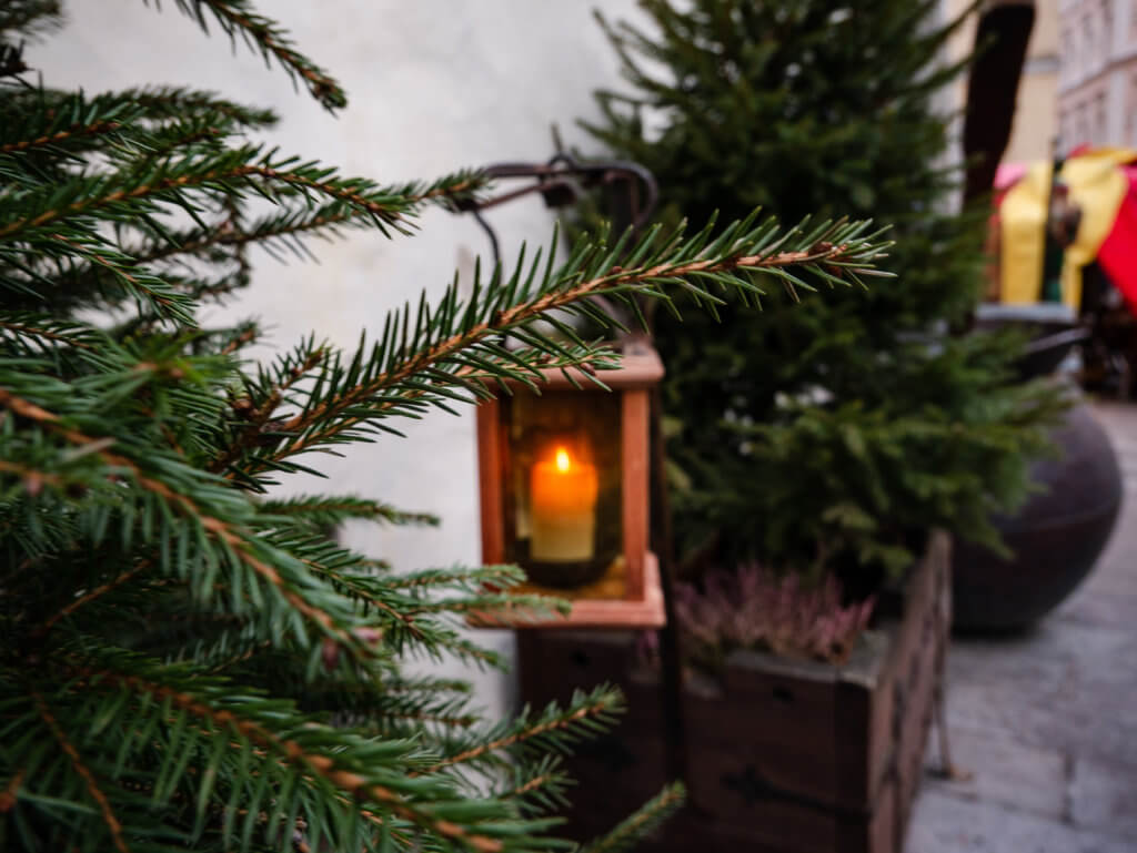 Candle in a wooden lantern at Olde Hansa medieval restaurant in Tallinn