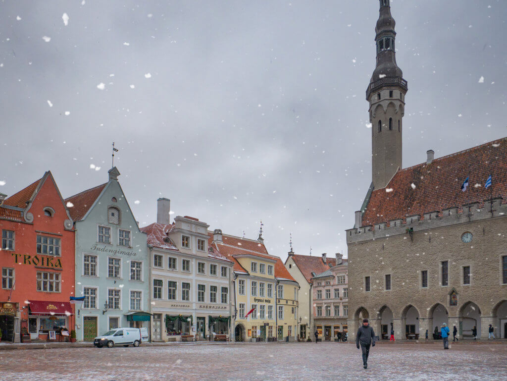 People walking in the snow in Tallinn's Town Hall Square in Old Town Tallinn