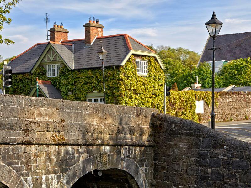 Bridge and an ivy clad house in the charming village of Westport Ireland