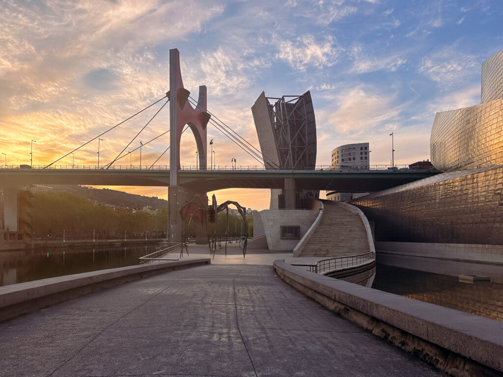 Maman sculpture and bridge in Bilbao at sunrise