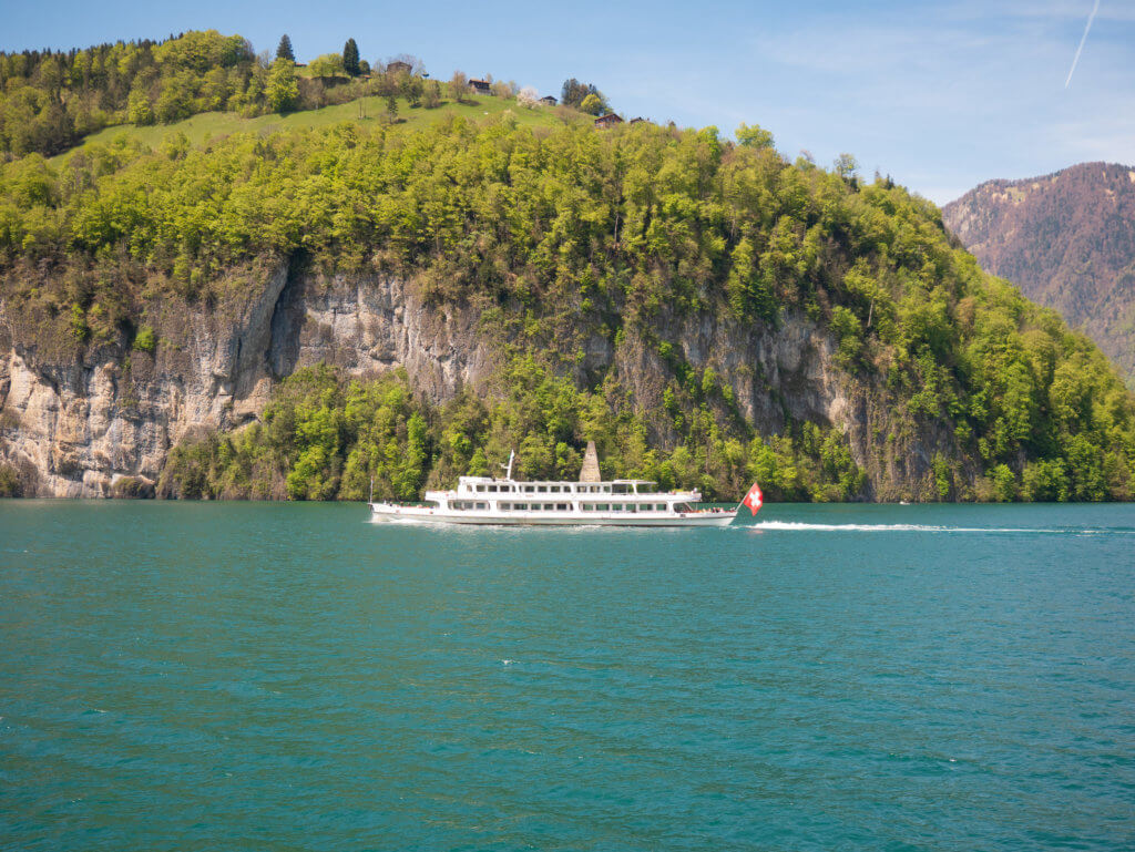Boat with Swiss flag on Lake Lucerne.