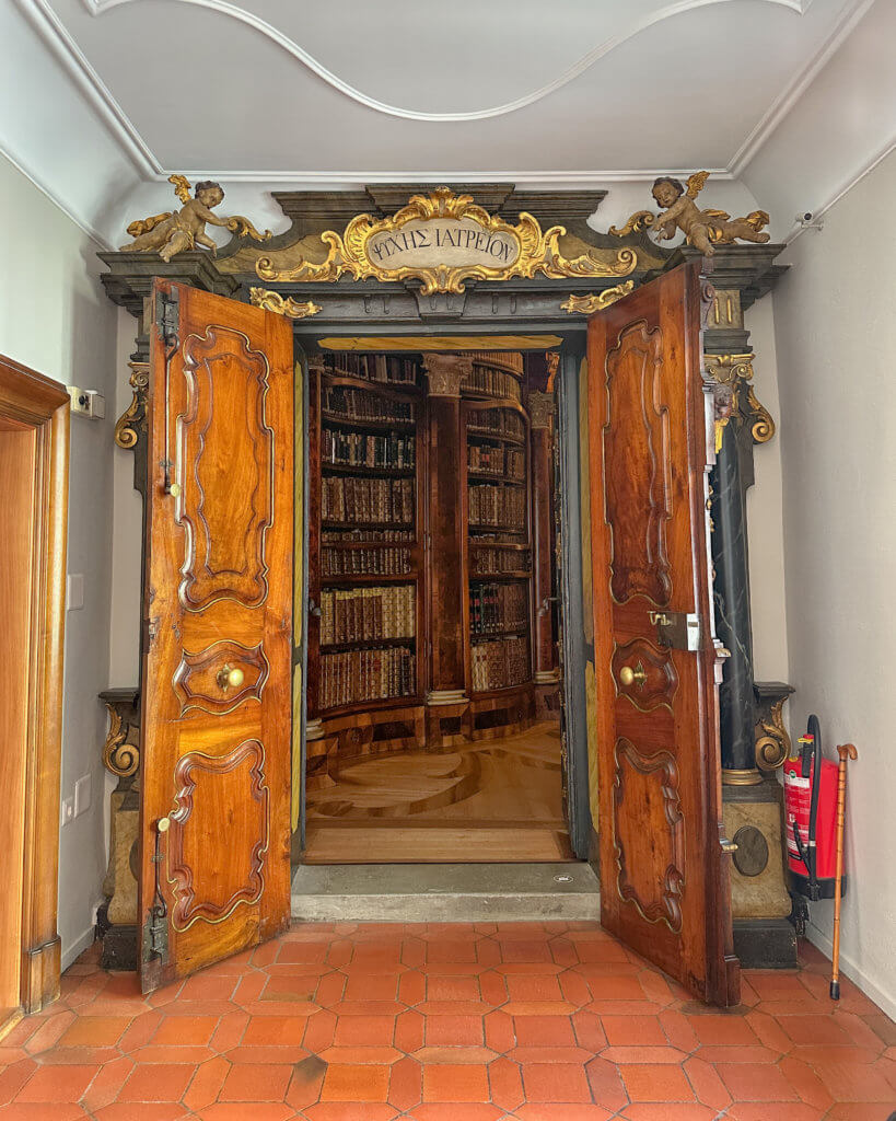 Entrance to the Abbey Library in St. Gallen. Inscription above its entrance reads ΨYXHΣ IATPEION, meaning ‘healing place for the soul’
