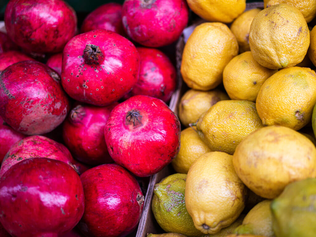 Pomegranates and lemons for sale at La Ribera Market in Bilbao Spain