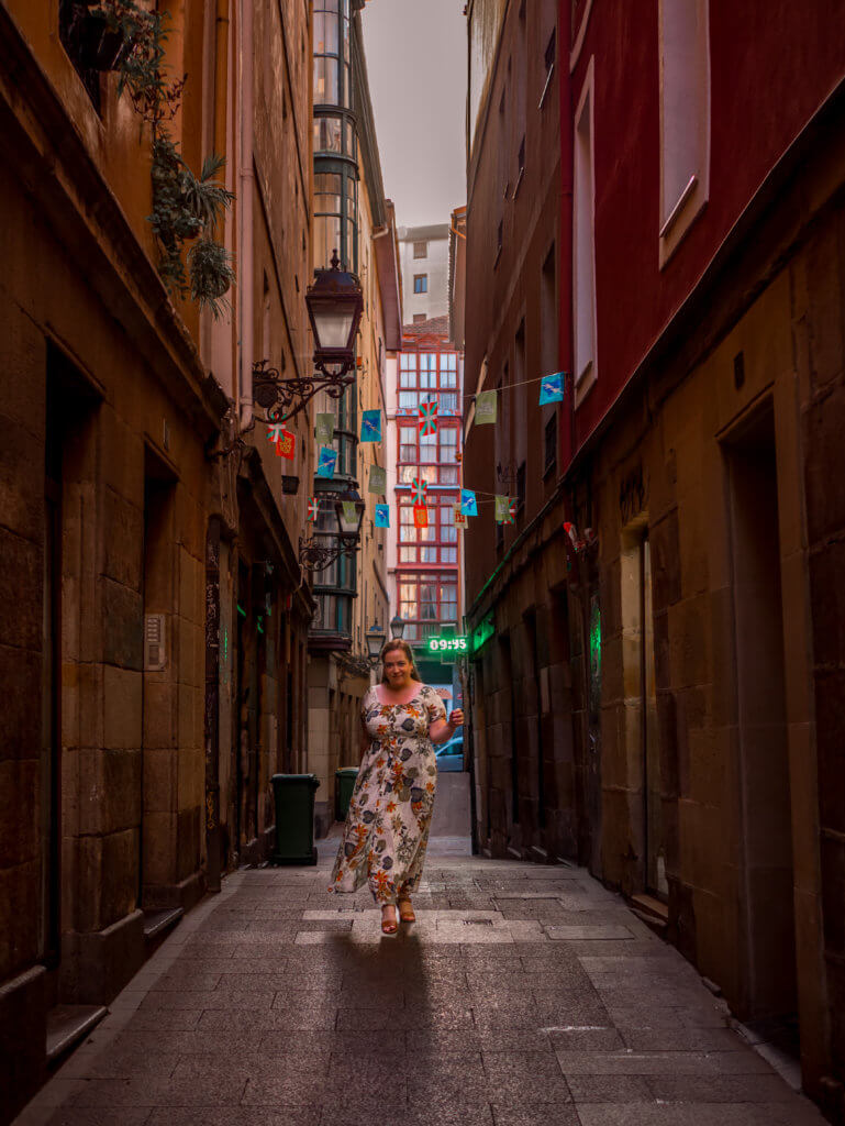 Nicola walks through the streets of Bilbao old town during one day in Bilbao