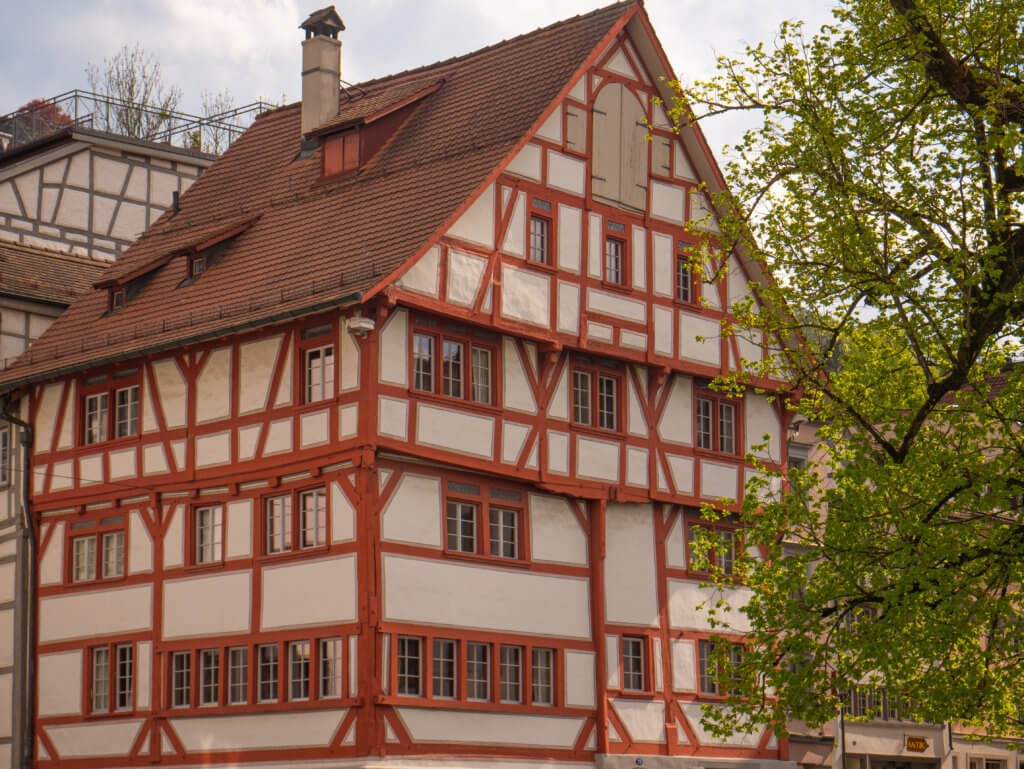 Red and white timber frame house in St. Gallen Switzerland