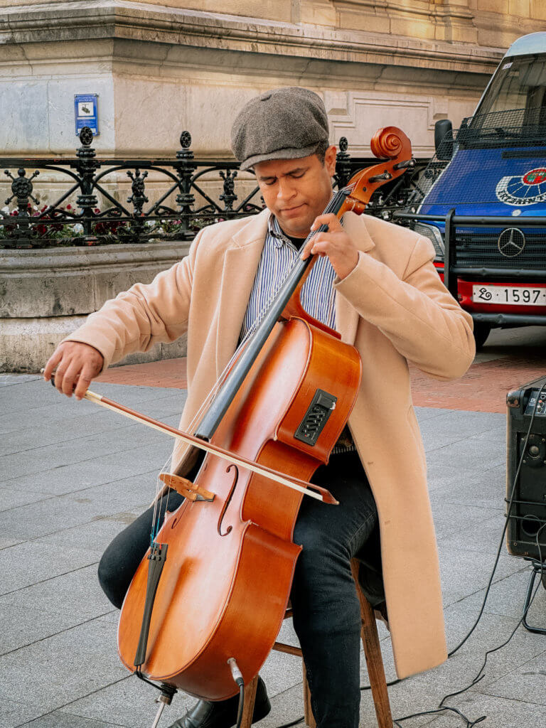 Man playing the cello on the streets of Bilbao