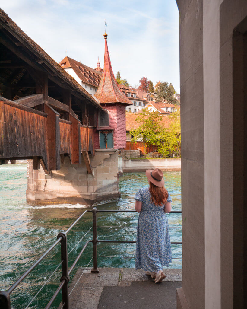 Nicola Lavin Travel Blogger looks at the wooden Spreuer Bridge in Lucerne Switzerland during 24 hours in Lucerne.