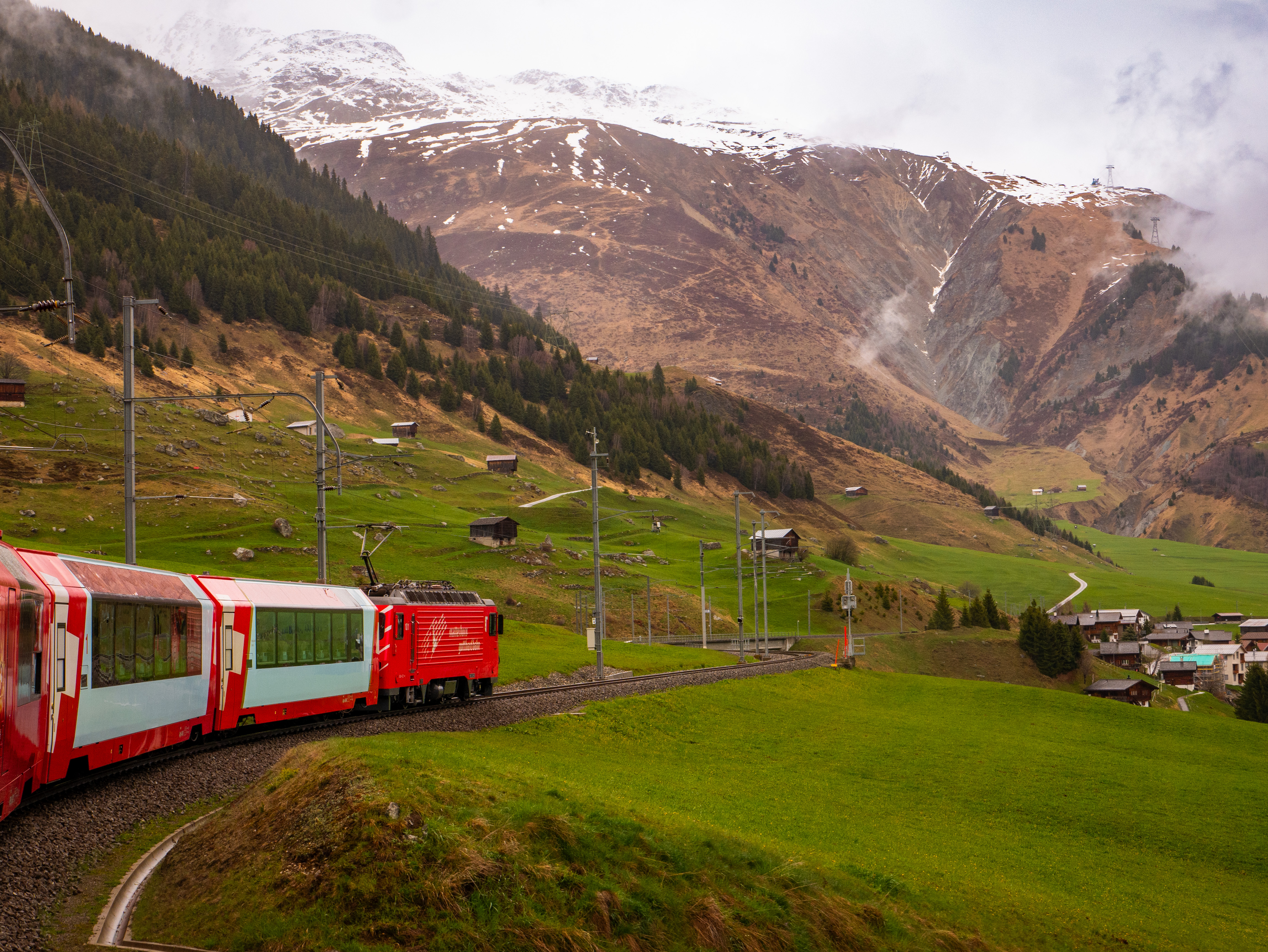 Glacier Express panoramic train travelling through the Swiss countryside