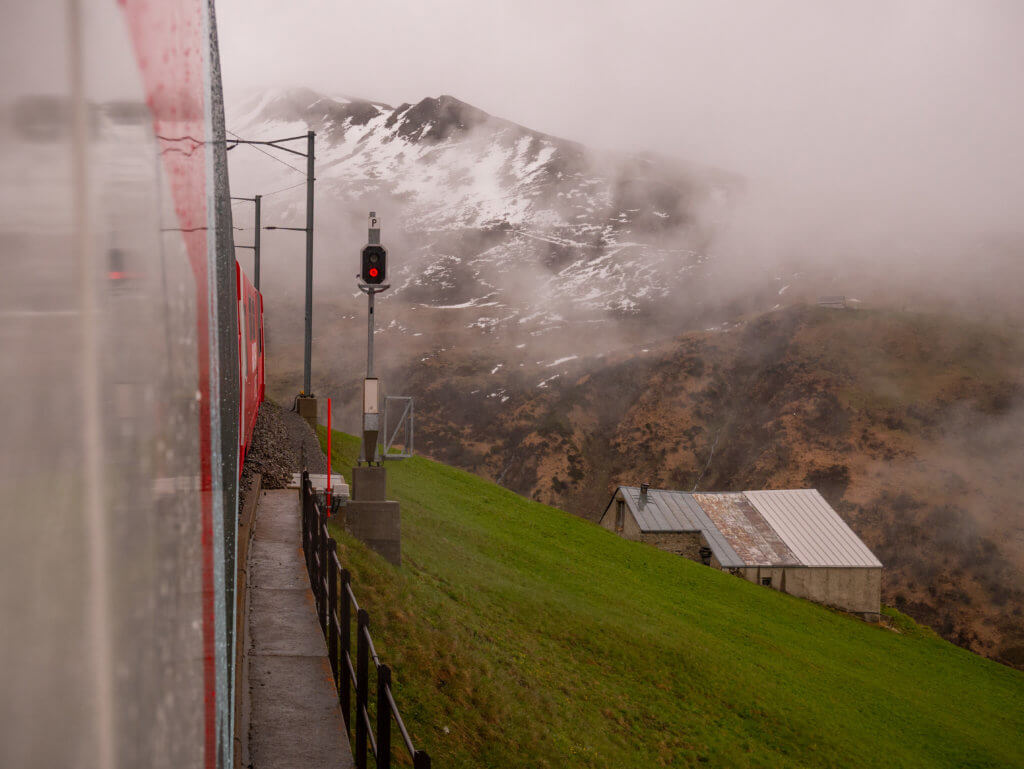 Glacier Express Train travelling through the Swiss Alps