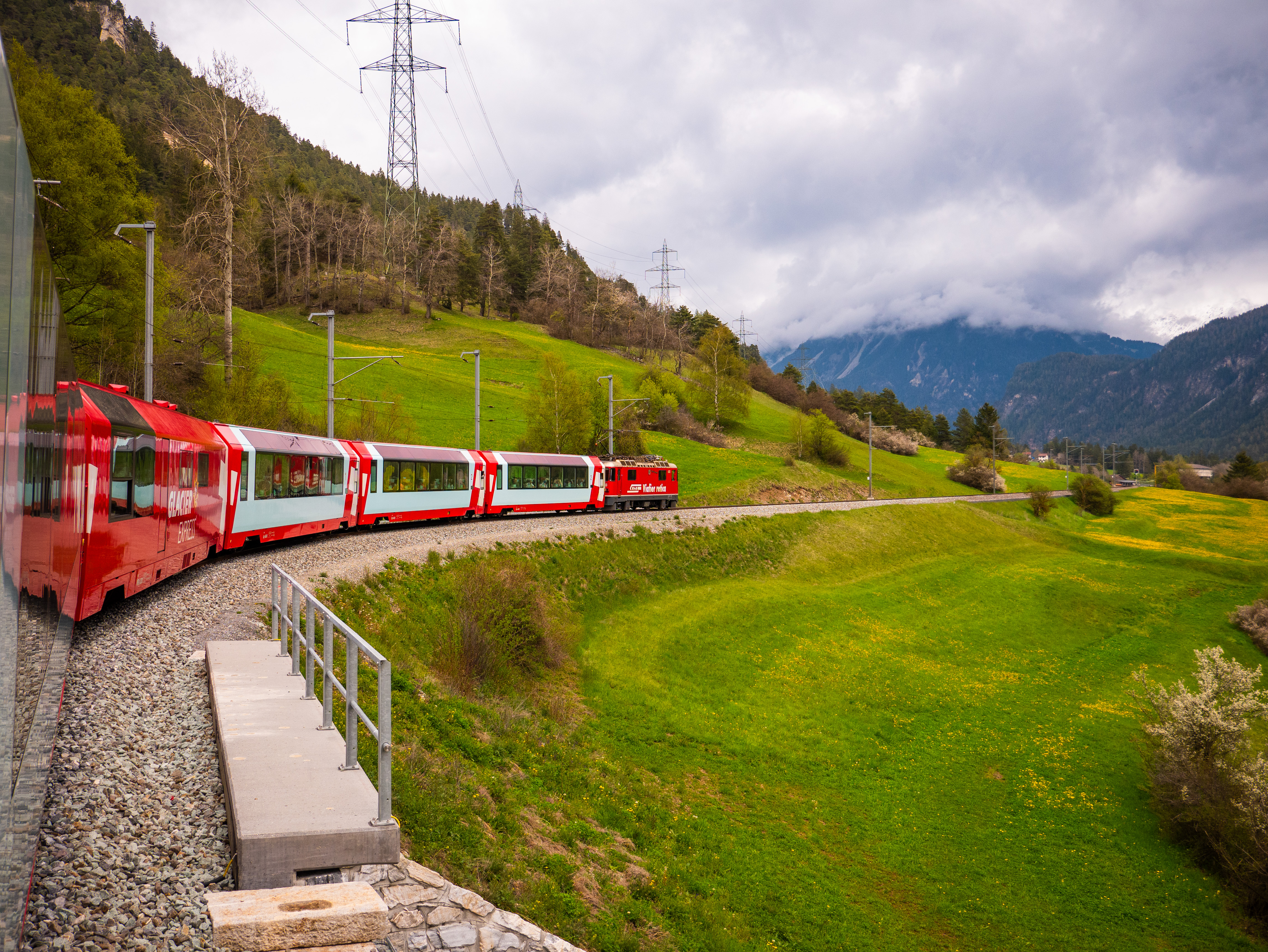 Glacier Express panoramic train In Switzerland travels through the Swiss countryside