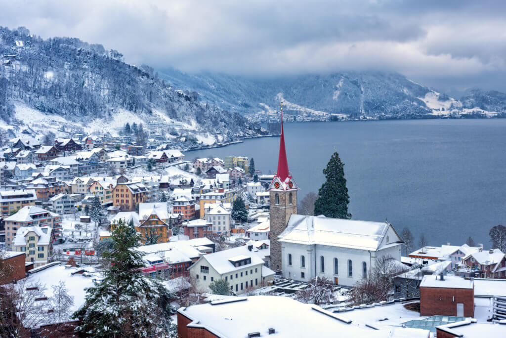 Charming Weggis village covered in snow on Lake Lucerne in winter