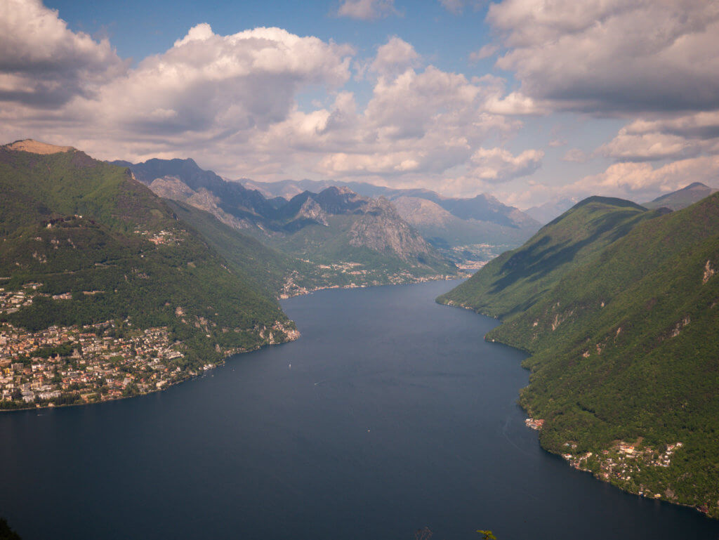 Aerial view of mountains and Lake Lugano from the viewpoint on Monte San Salvatore in Lugano Switzerland.