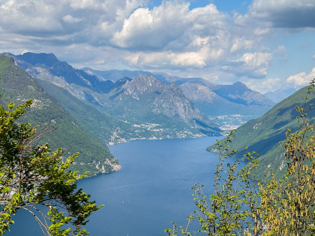 Aerial view of mountains and lake lugano in ticino switzerland.