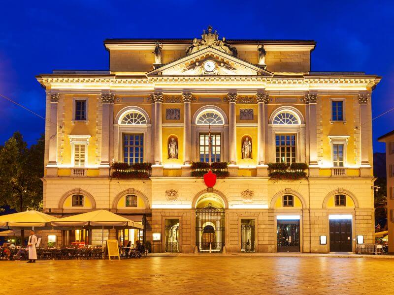 Building on Via Nassa Street in Lugano at night.