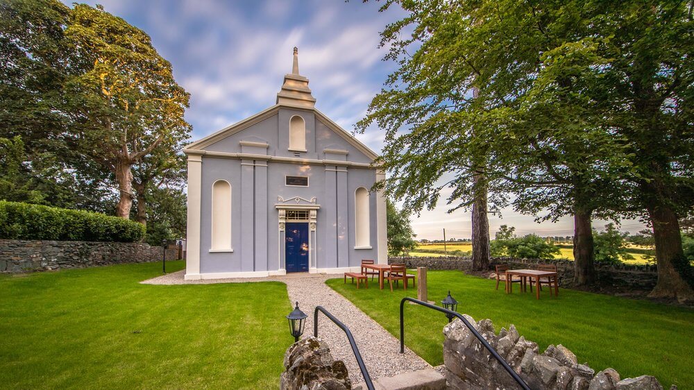 Blue church called Quarry Hill Church that has been converted into a luxury and unique holiday accommodation in Northern Ireland.