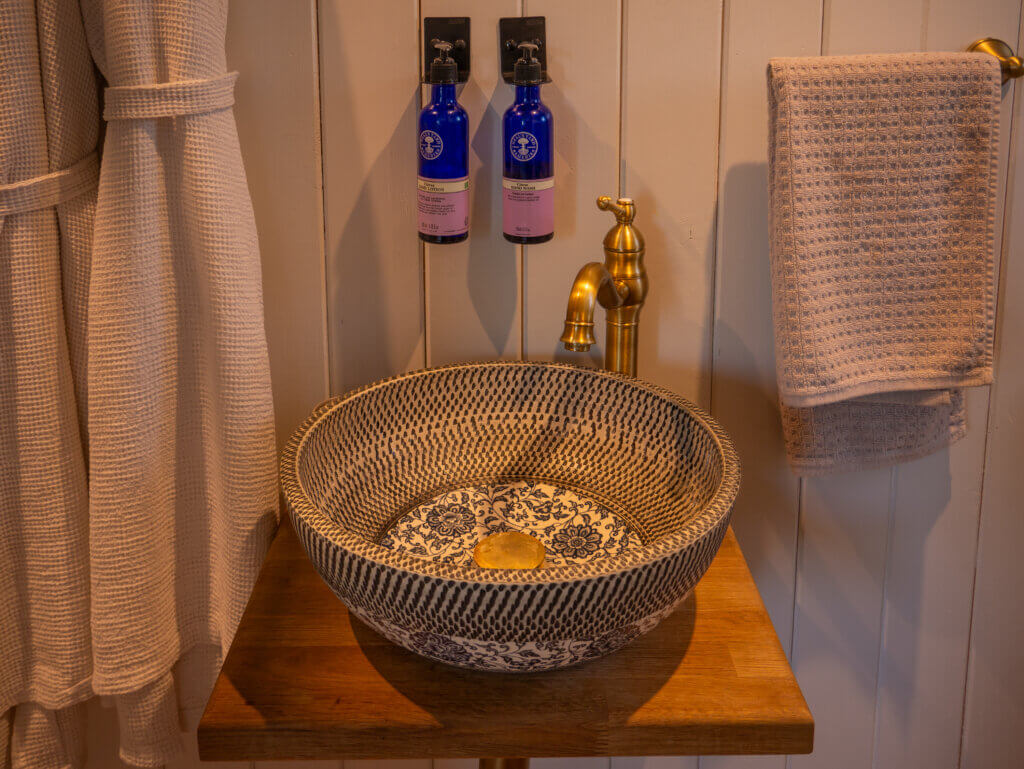 Unique ceramic sink in a bathroom at Slieve Croob Shepherds hut in Northern Ireland