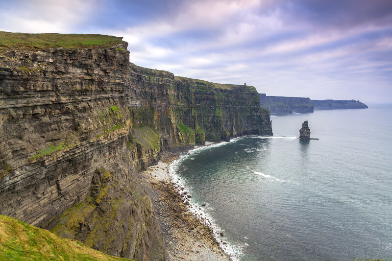 The weathered rock face of the Cliffs of Moher, showcasing its intricate patterns and textures.