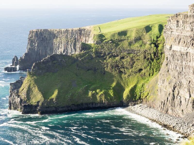 A moment of peace and tranquility amidst the rugged landscape of the Cliffs of Moher, Ireland.