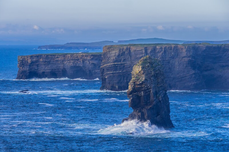 Iconic Kilkee Cliffs showcases Ireland's wild and rugged terrain.