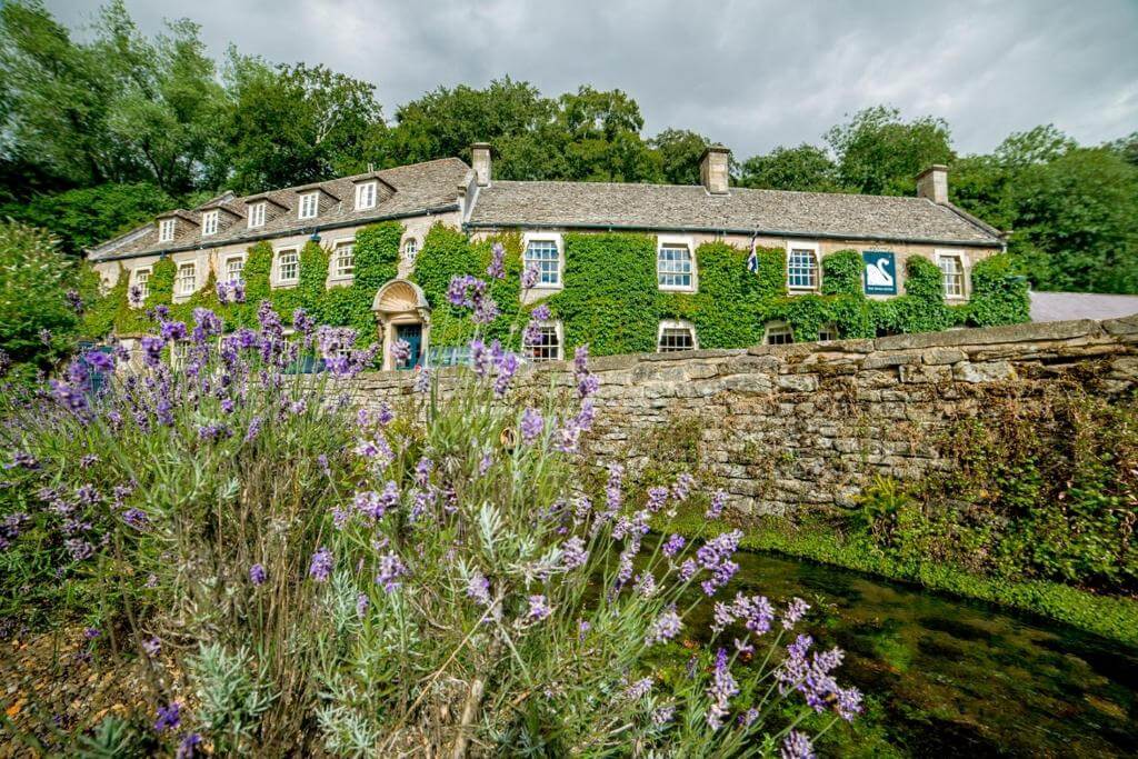 Lavender frames the Swan Hotel in the picturesque village of Bibury.