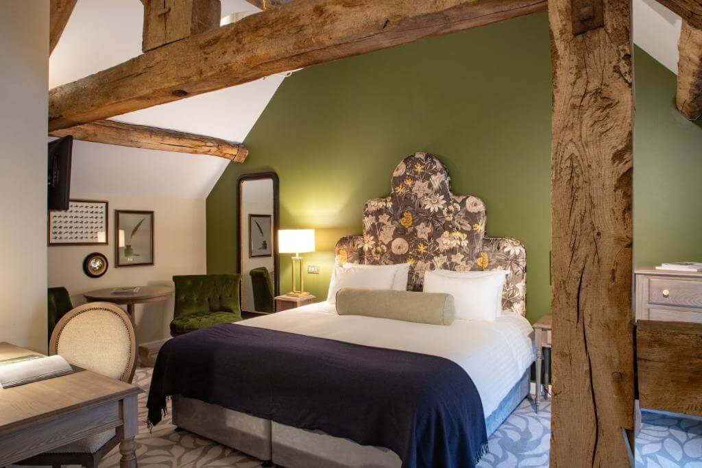 Chic and modern guest room in a luxury Cotswolds hotel, featuring upscale amenities and elegant furnishings.