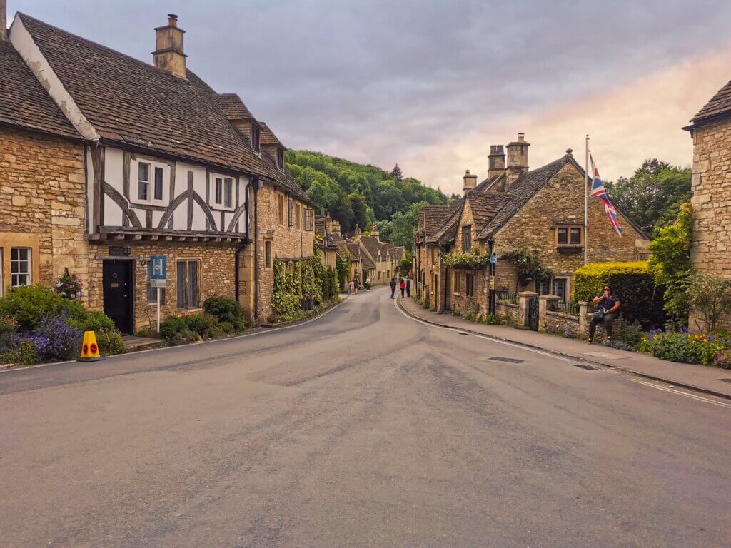 Charming village square with historic buildings in the fairytale village of Castle Combe in the Cotswolds.
