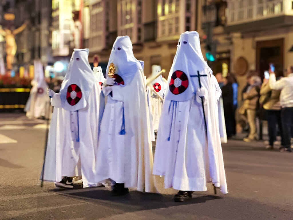 Hooded figures marching in a Semana Santa procession in Vitoria Gastiez, Spain.
