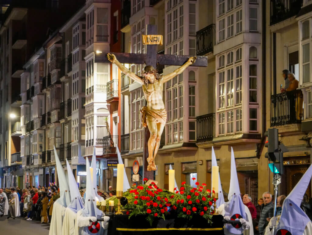Captivating view of the Easter parade in Vitoria Gastiez, with crowds lining the streets to witness the religious spectacle.