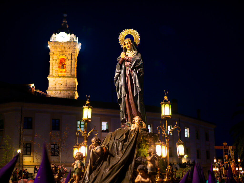 Malaga's Easter parade: A solemn procession accompanied by traditional music and chanting.