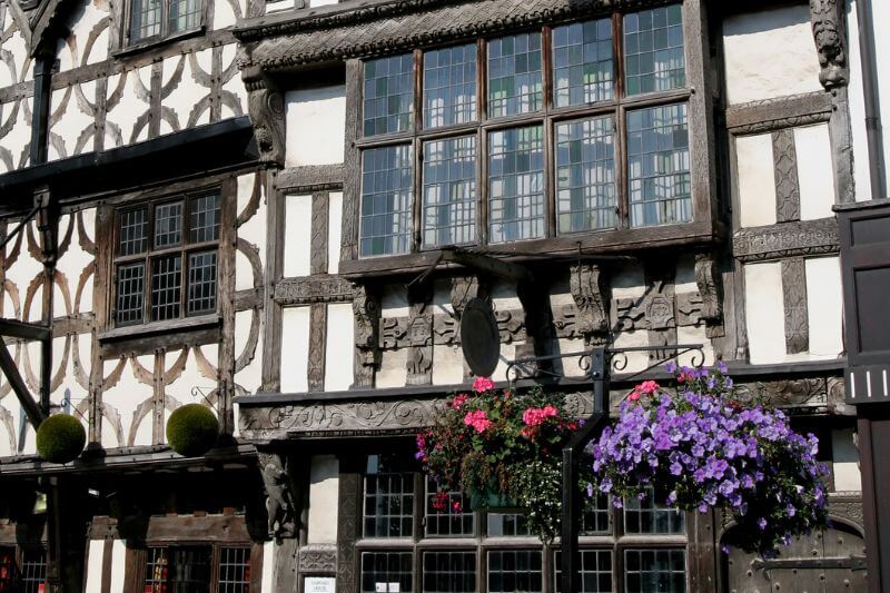 Charming Tudor building with distinctive black-and-white timber frames in Stratford-upon-Avon.