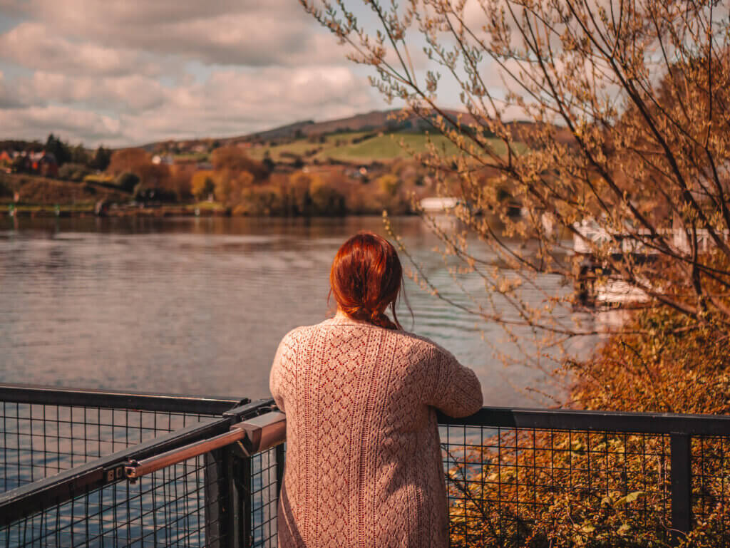 Nicola Lavin, an irish travel blogger looks out onto the River Shannon during her time exploring County Tipperary.