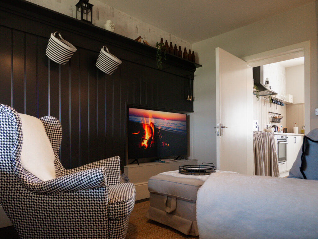 The cosy living room inside the Loop Head Lighthouse cottage has traditional decor.