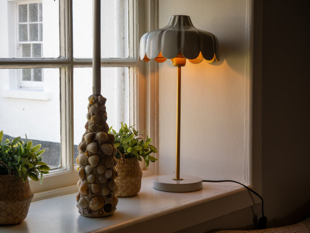 A comfortable seating area in the lighthouse cottage, offering views of the surrounding landscape.