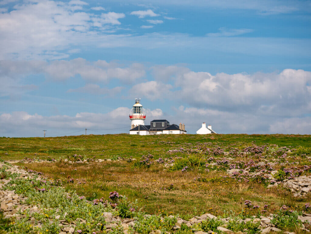 Loop Head Lighthouse on a sunny autumn day in Ireland.