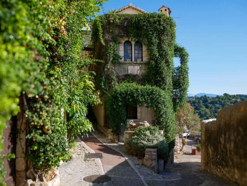 Stone facade covered in jasmine of the fairytale cottage La Miette in Saint Paul de Vence France